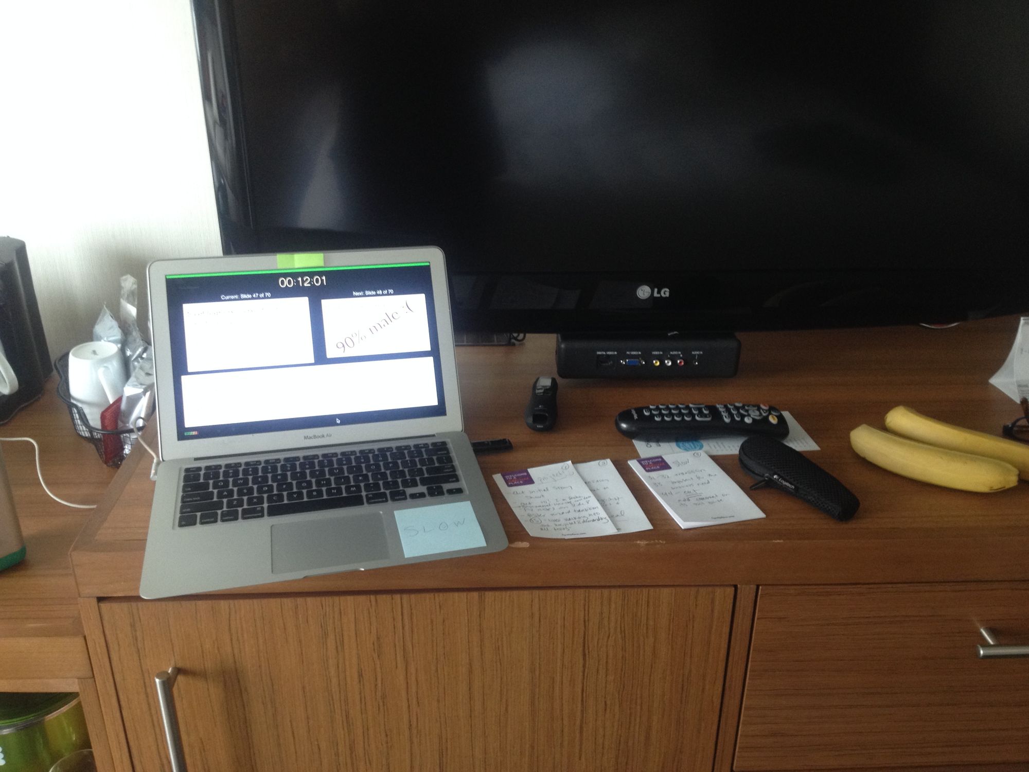 A picture of my laptop and notes on a hotel dresser.